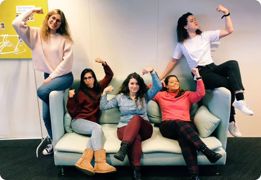 a group of people sitting posing for the camera